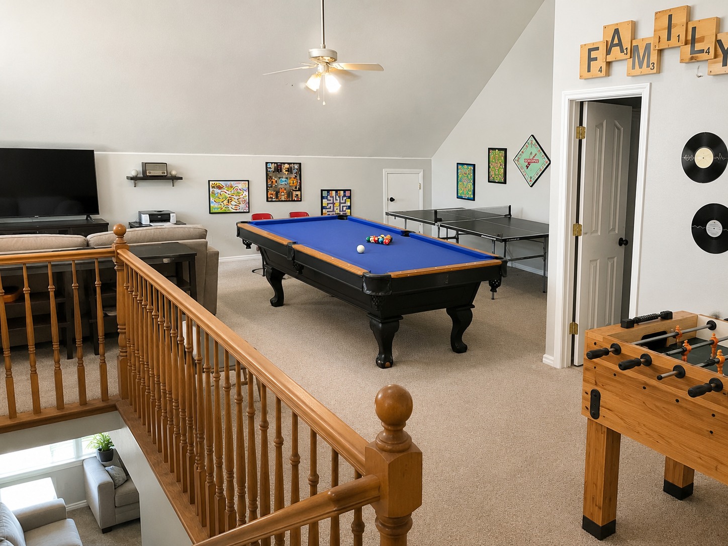 The Good Life game room with pool table, ping pong, and foosball