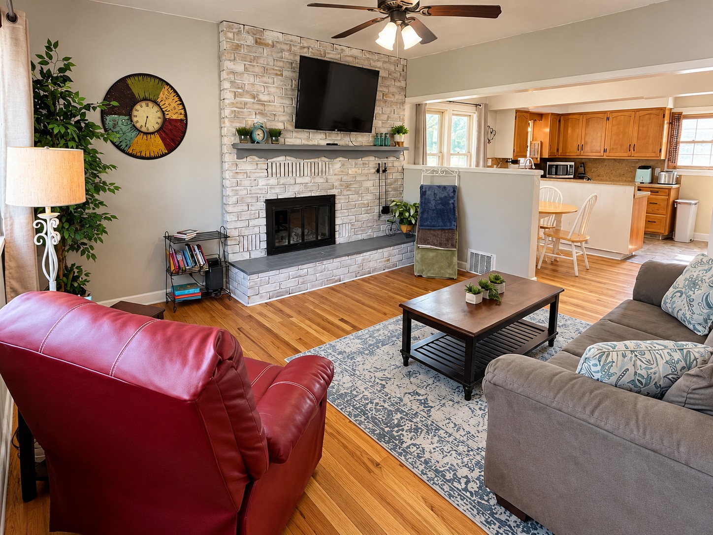 The Historic Cottage living room with brick fireplace and seating